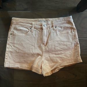 Super cute neon peach denim colored shorts.